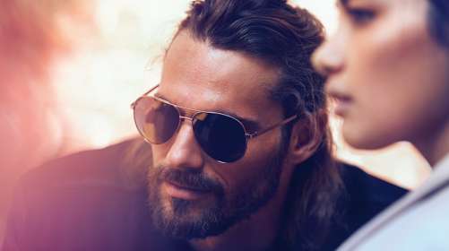 couple in front of car